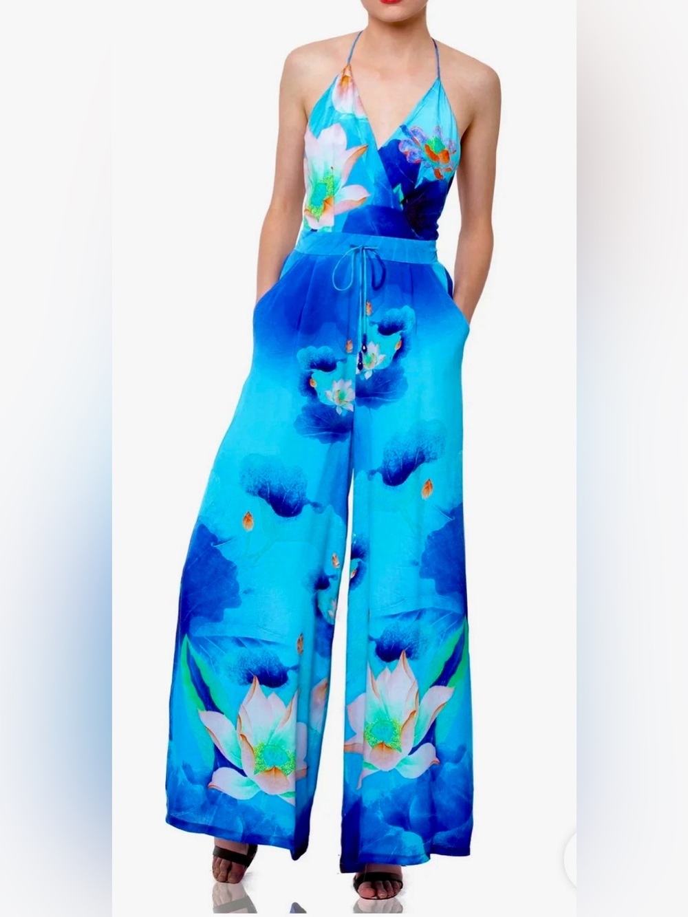 Wide leg jumpsuit. Floral lotus print, halter neck, open back. Stretchy waist. S